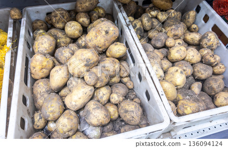 Fresh organic potatoes selling at the grocery store Fresh organic potatoes selling at the grocery store 136094124