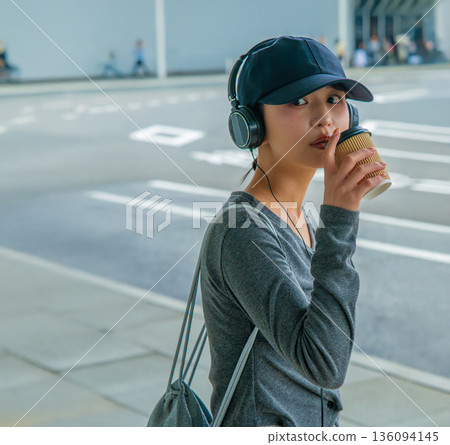 A woman drinking coffee at the airport. Photo courtesy of Kansai International Airport (KIX). A woman drinking coffee at the airport. Photo courtesy of Kansai International Airport (KIX). 136094145