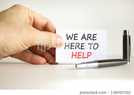 Support, help and we are here to help symbol. Concept words We are here to help on beautiful card. Beautiful white background. Businessman's hand. Business we are here to help concept. Copy space. Support, help and we are here to help symbol. Concept words We are here to help on beautiful card. Beautiful white background. Businessman's hand. Business we are here to help concept. Copy space. 136095502