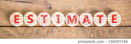 Estimate word symbol. Concept word Estimate on beautiful wooden circles. Beautiful wooden background. Business support help estimate word concept. Copy space. 136095596