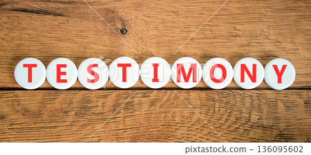 Testimony symbol. Concept word Testimony on beautiful white circles. Beautiful wooden background. Business education support testimony concept. Copy space. 136095602