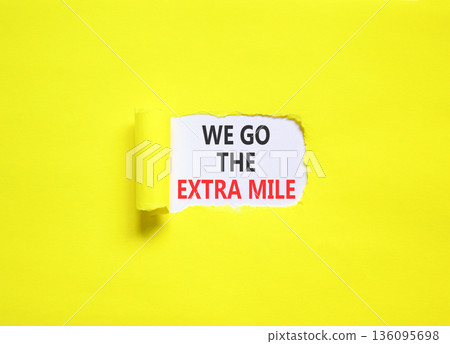 Support, help we go the extra mile symbol. Concept words We go the extra mile on beautiful white paper. Beautiful yellow paper background. Business we go the extra mile concept. Copy space. Support, help we go the extra mile symbol. Concept words We go the extra mile on beautiful white paper. Beautiful yellow paper background. Business we go the extra mile concept. Copy space. 136095698