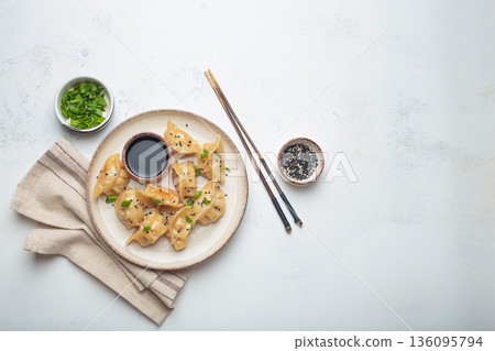 Gyoza dumplings soy sauce chopsticks asian Japanese food wontons copy space 136095794