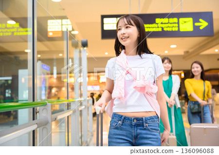 A woman enjoying her trip at the airport. Photo courtesy of Kansai International Airport (KIX). A woman enjoying her trip at the airport. Photo courtesy of Kansai International Airport (KIX). 136096088