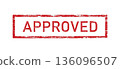 A red rectangular stamp with the words Approved on a white background 136096507