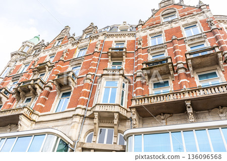 Canal Houses facade of Amsterdam City in Netherlands street building architecture. 136096568