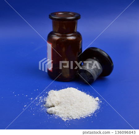 Sodium diethyldithiocarbamate powder on the light gray background 136096843
