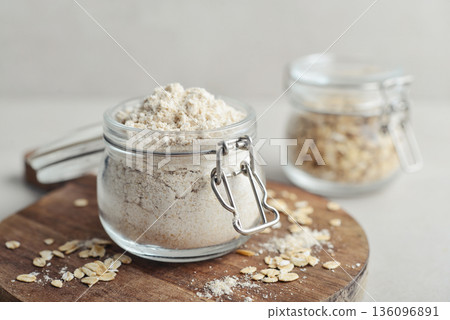 Oat flour in glass jar 136096891