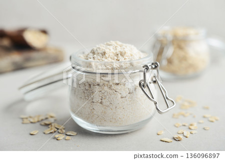 Oat flour in glass jar 136096897