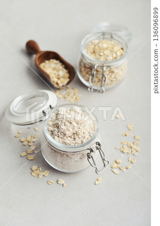 Oat flour in glass jar Oat flour in glass jar 136096899