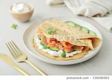 Oatmeal pancakes with slightly salted salmon 136096903