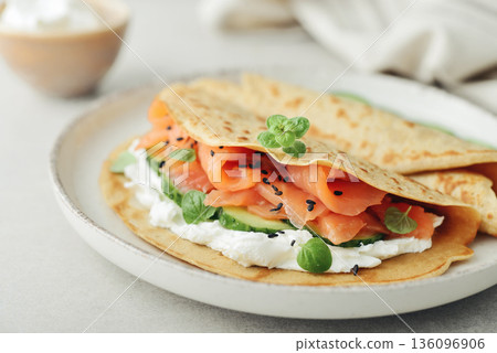 Oatmeal pancakes with slightly salted salmon 136096906