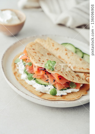 Oatmeal pancakes with slightly salted salmon Oatmeal pancakes with slightly salted salmon 136096908