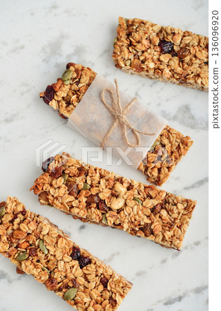 Gluten-free oat granola bars with nuts and berries. 136096920