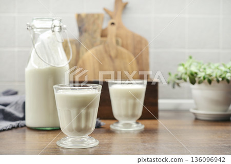 Two glasses of Turkish traditional drink ayran, kefir or buttermilk Two glasses of Turkish traditional drink ayran, kefir or buttermilk 136096942