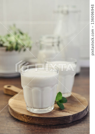 Two glasses of Turkish traditional drink ayran, kefir or buttermilk Two glasses of Turkish traditional drink ayran, kefir or buttermilk 136096948