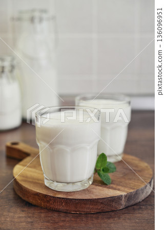 Two glasses of Turkish traditional drink ayran, kefir or buttermilk Two glasses of Turkish traditional drink ayran, kefir or buttermilk 136096951