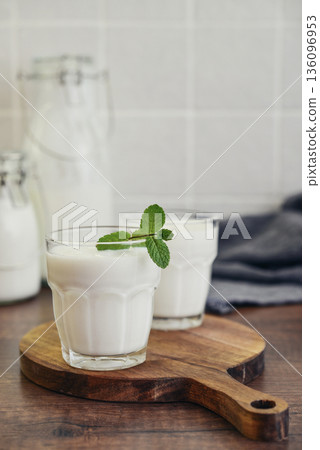 Two glasses of Turkish traditional drink ayran, kefir or buttermilk Two glasses of Turkish traditional drink ayran, kefir or buttermilk 136096953
