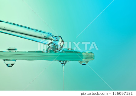 Dropper applying liquid chemical serum onto glass surface Dropper applying liquid chemical serum onto glass surface 136097181