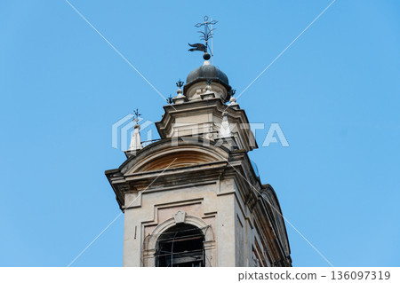The top of a historic building in Sabbioneta, Italy, against a clear blue sky. The top of a historic building in Sabbioneta, Italy, against a clear blue sky. 136097319