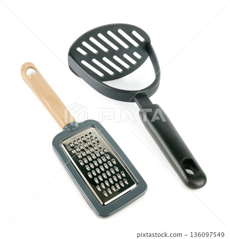 Manual Hand Grater and Potato Masher Kitchen Tools Isolated on White Manual Hand Grater and Potato Masher Kitchen Tools Isolated on White 136097549