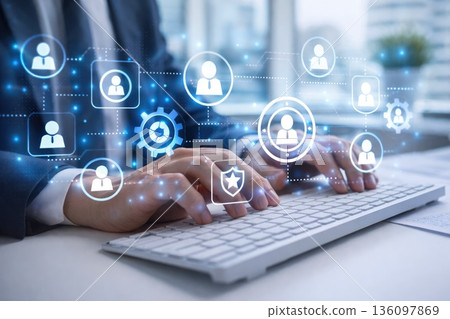Businessman Typing on Keyboard with Digital Network and Security Icons Overlay 136097869