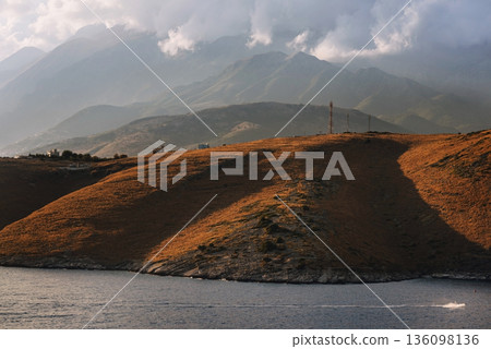 Dramatic Coastal Landscape with Misty Mountains 136098136