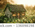 A small cottage is adorned with shamrocks and green garlands. The setting is bright and festive, celebrating St. Patricks Day with greenery surrounding the cottage 136098198