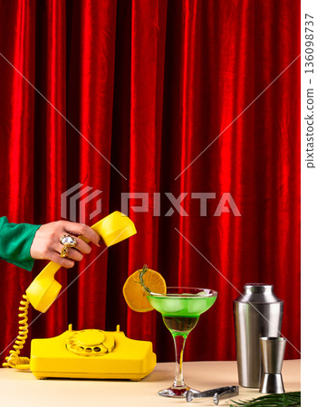 Retro green cocktail against a red curtain 136098737