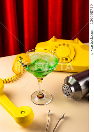 Retro green cocktail against a red curtain Retro green cocktail against a red curtain 136098759