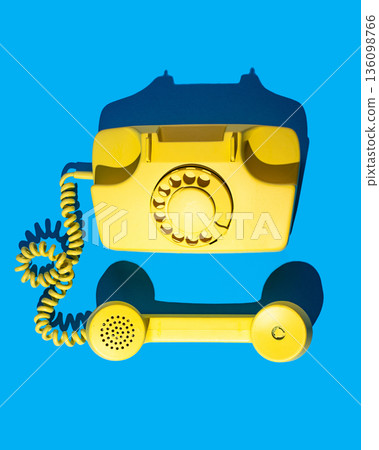 Retro vintage yellow rotary telephone 136098766
