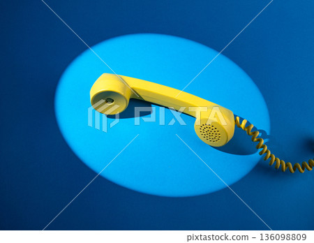 Retro vintage yellow rotary telephone 136098809