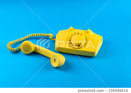 Retro vintage yellow rotary telephone 136098818