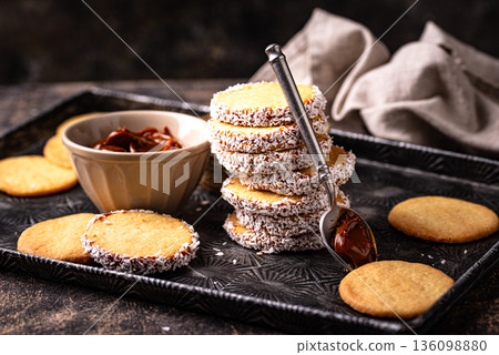 Alfajores, traditional Spanish sandwich cookies Alfajores, traditional Spanish sandwich cookies 136098880