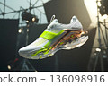 Running shoe cutaway revealing internal technology. Athletic footwear design with cushioning and support. Modern sneaker construction for sport. 136098916