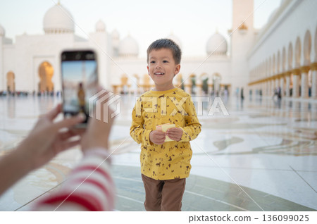 Mother Photographing Her Son at Sheikh Zayed Grand Mosque in Abu Dhabi United Arab Emirates 136099025