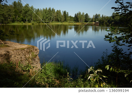 Picturesque lakeside of the lake pond in Ilemnya, Ilemnia ponds, Kalush raion, former Rozhniativ Raion, Ivano-Frankivsk Oblast, Ukraine. Tourism in Gorgany low-mountains, Ukrainian Carpathians Picturesque lakeside of the lake pond in Ilemnya, Ilemnia ponds, Kalush raion, former Rozhniativ Raion, Ivano-Frankivsk Oblast, Ukraine. Tourism in Gorgany low-mountains, Ukrainian Carpathians 136099194