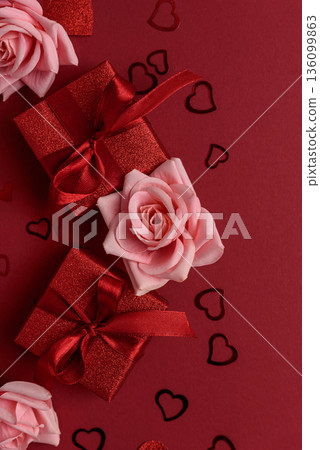 Festive Red Gift Boxes with Roses and Heart Confetti on Red Festive Background for Valentines Day Celebration Festive Red Gift Boxes with Roses and Heart Confetti on Red Festive Background for Valentines Day Celebration 136099863