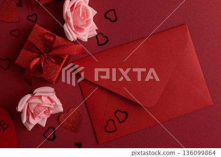 Romantic Envelope with Gifts and Roses on Festive Red Background for Valentines Day Celebration 136099864