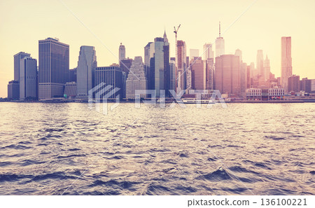 New York City waterfront at sunset, color toning applied, United States. New York City waterfront at sunset, color toning applied, United States. 136100221
