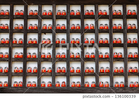 Symbol of determination, good luck charm in Japanese, Many traditional red Daruma doll at Katsuo-ji temple, Osaka, Japan. 136100339