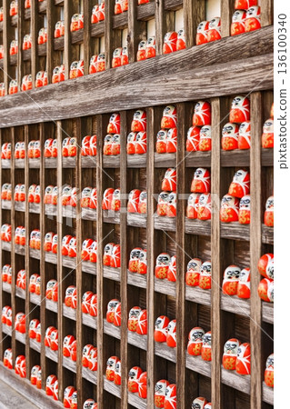 Symbol of determination, good luck charm in Japanese, Many traditional red Daruma doll at Katsuo-ji temple, Osaka, Japan. 136100340