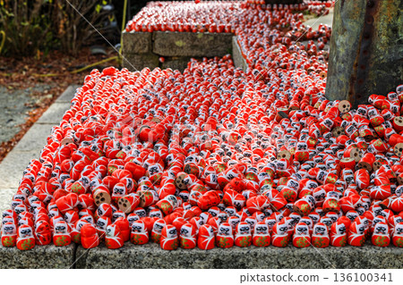 Symbol of determination, good luck charm in Japanese, Many traditional red Daruma doll at Katsuo-ji temple, Osaka, Japan. 136100341