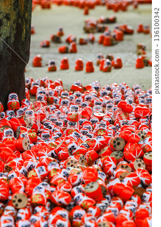 Symbol of determination, good luck charm in Japanese, Many traditional red Daruma doll at Katsuo-ji temple, Osaka, Japan. 136100342