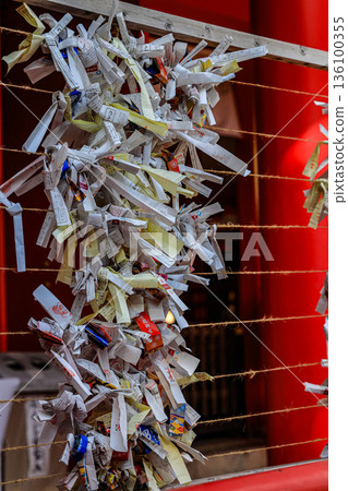 Shimonoseki, JAPAN - 9 DEC 2025: hanging tied of bad luck predict fortune paper ( Omikuji ) on wire at Akama Shinto shrine in Shimonoseki. Shimonoseki, JAPAN - 9 DEC 2025: hanging tied of bad luck predict fortune paper ( Omikuji ) on wire at Akama Shinto shrine in Shimonoseki. 136100355