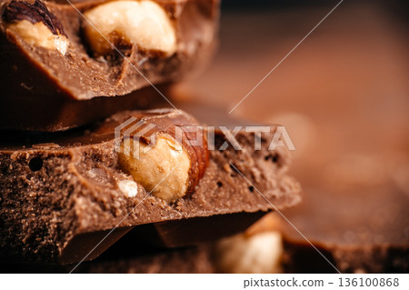 Milk chocolate with hazelnuts macro close up Milk chocolate with hazelnuts macro close up 136100868