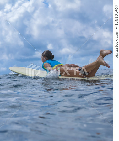 Youthful Woman Demonstrating Paddling Ability 136101457
