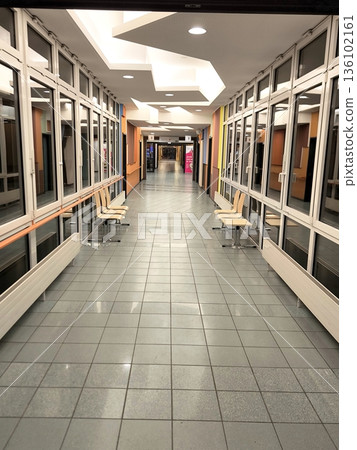 Modern corridor in a public building or clinic. Modern corridor in a public building or clinic. 136102161