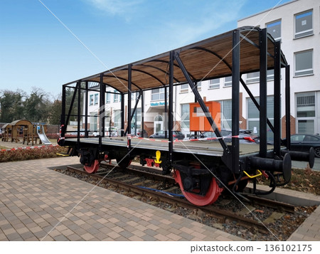 A restored wooden railway platform car on the tracks A restored wooden railway platform car on the tracks 136102175