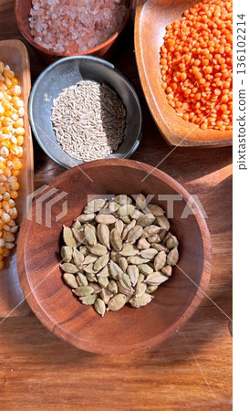 Ingredients Arranged On Wooden Background, Spilled Spices And Grains On Rustic Surface, Artfully Arranged Collection Of Cooking Essentials With Rich Textures And Inviting Tones Ingredients Arranged On Wooden Background, Spilled Spices And Grains On Rustic Surface, Artfully Arranged Collection Of Cooking Essentials With Rich Textures And Inviting Tones 136102214